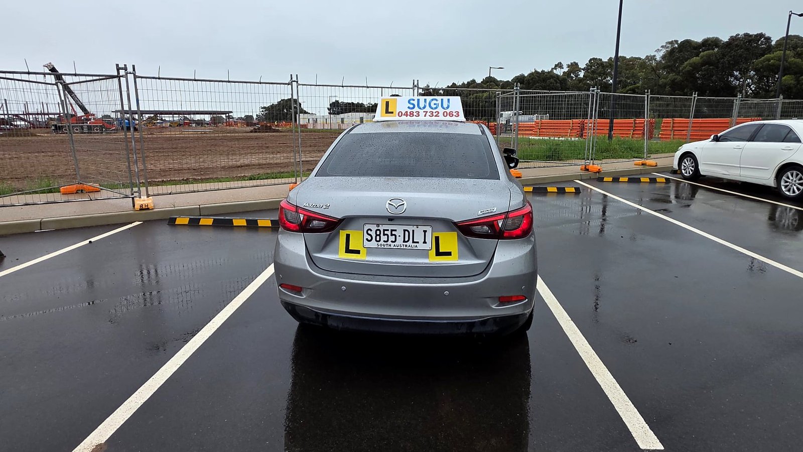 The Sugu Driving School Mazda 2 on L plates at the Adelaide practice area